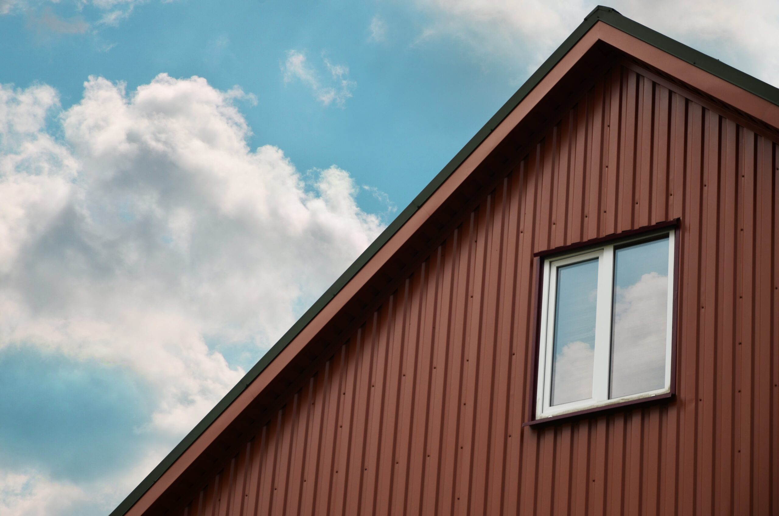 side of a house with brown siding